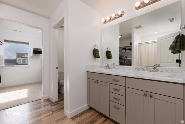 1654 South 730 West Provo, UT 84601 - Photo 20 of 33 Dual vanity with gray cabinetry, undermount sinks, and a marble-patterned countertop