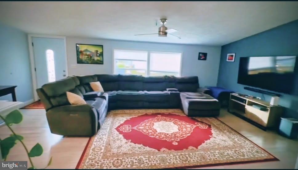 225 Poclain Road Aberdeen, MD 21001 - Photo 5 of 10 a living room with furniture and a flat screen tv
