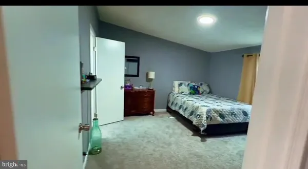 a bedroom with a bed and a table