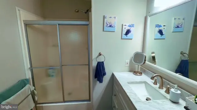 a bathroom with a sink and mirror