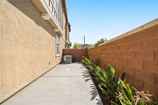a view of a potted plants next to a wall