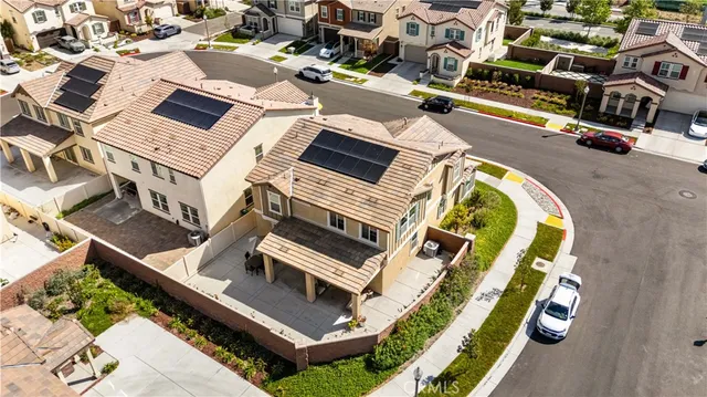 an aerial view of a house with a swimming pool