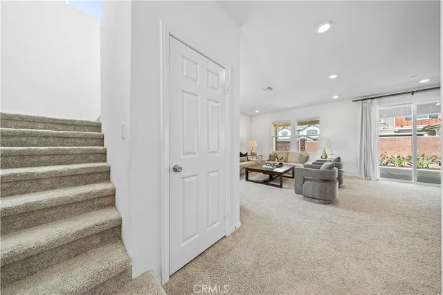 a view of a livingroom with furniture and a window