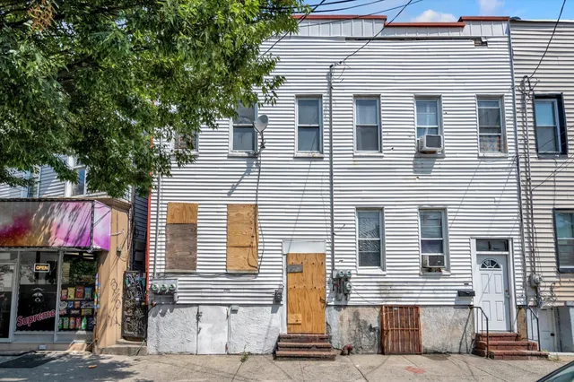 a front view of a house with a garage