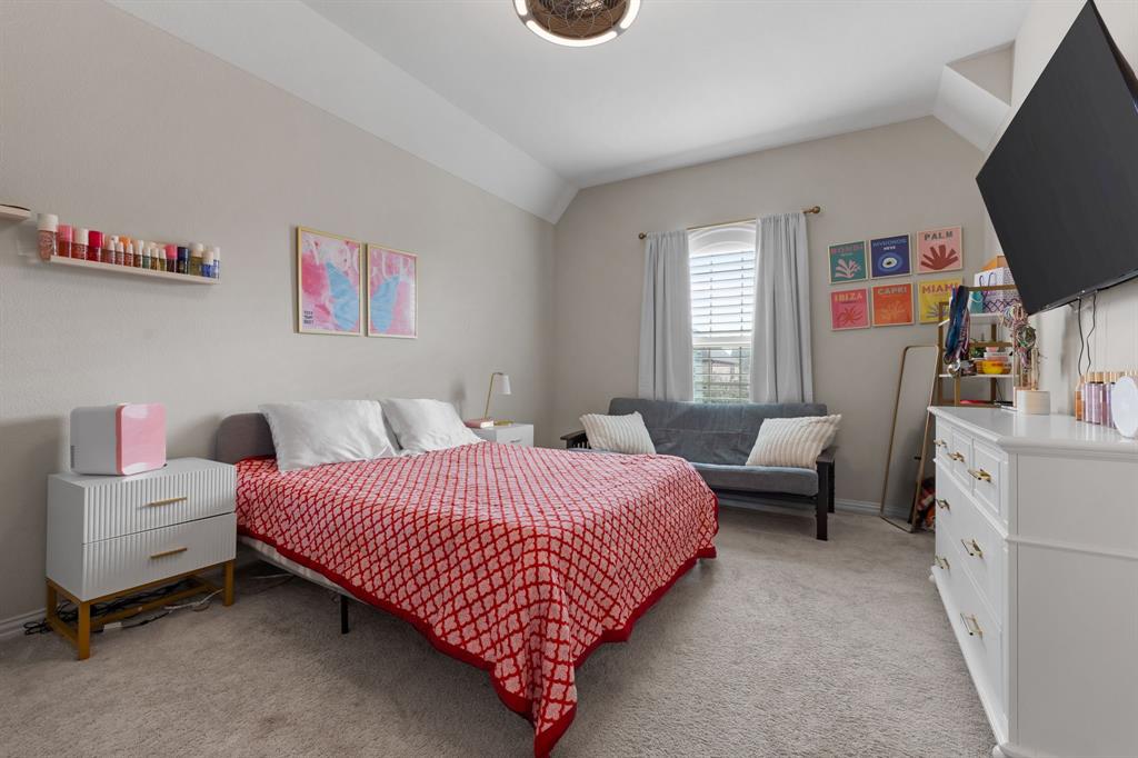 1806 Evening Star Road Frisco, TX 75033 - Photo 33 of 38 Bedroom featuring vaulted ceiling and light colored carpet
