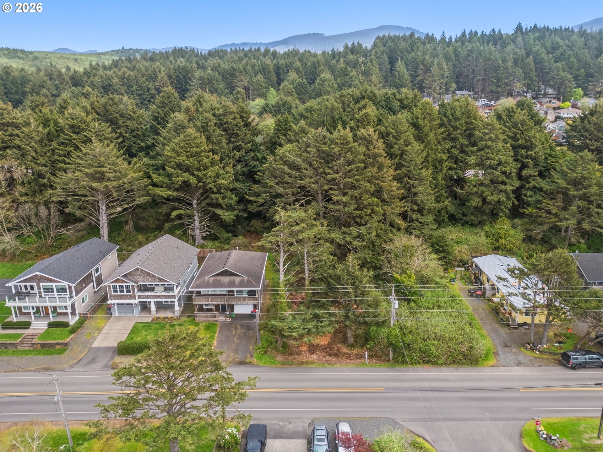 South Hemlock Street Cannon Beach, OR 97110 - Photo 10 of 12 an aerial view of a house with a green yard