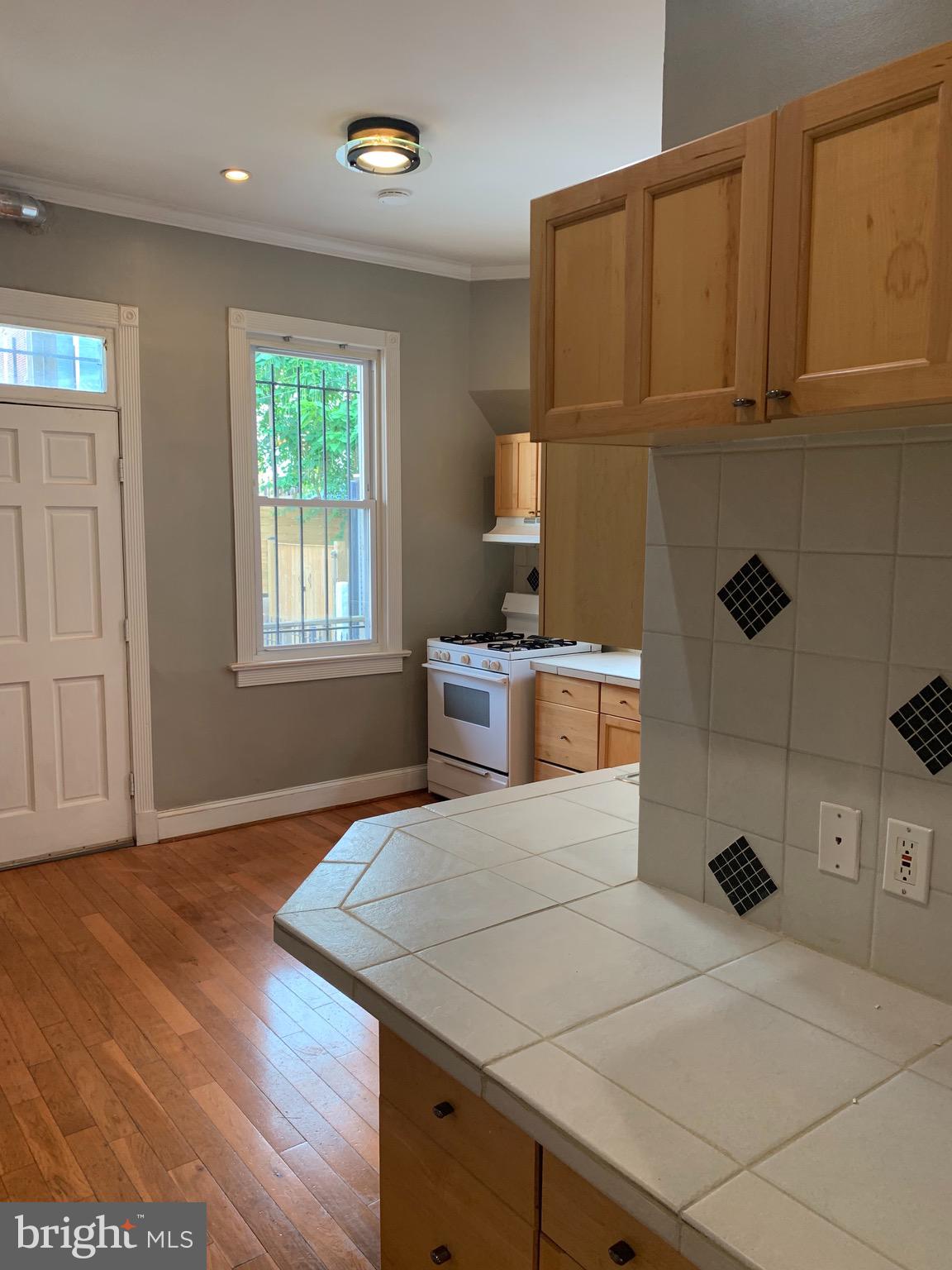 15 Seaton Place Northwest, Unit 1 Washington, DC 20001 - Photo 13 of 34 a bedroom with a bed and a window