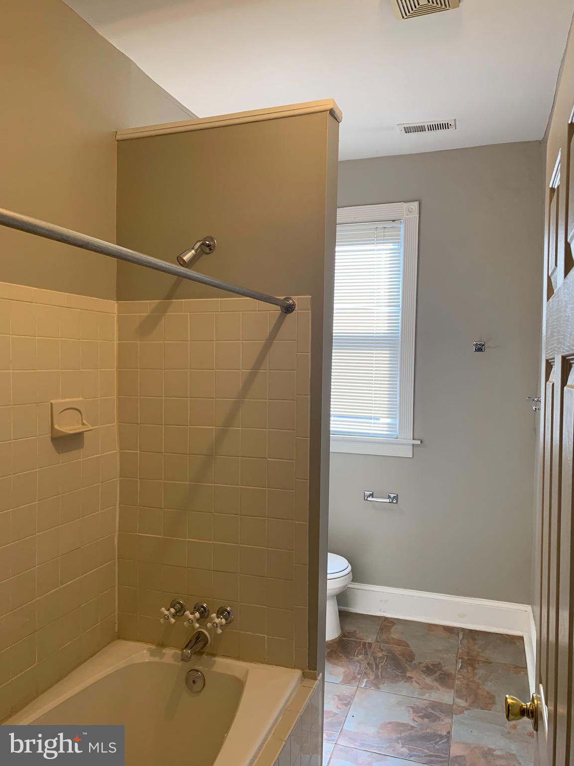 15 Seaton Place Northwest, Unit 1 Washington, DC 20001 - Photo 30 of 34 a bathroom with a tub a sink and glass door