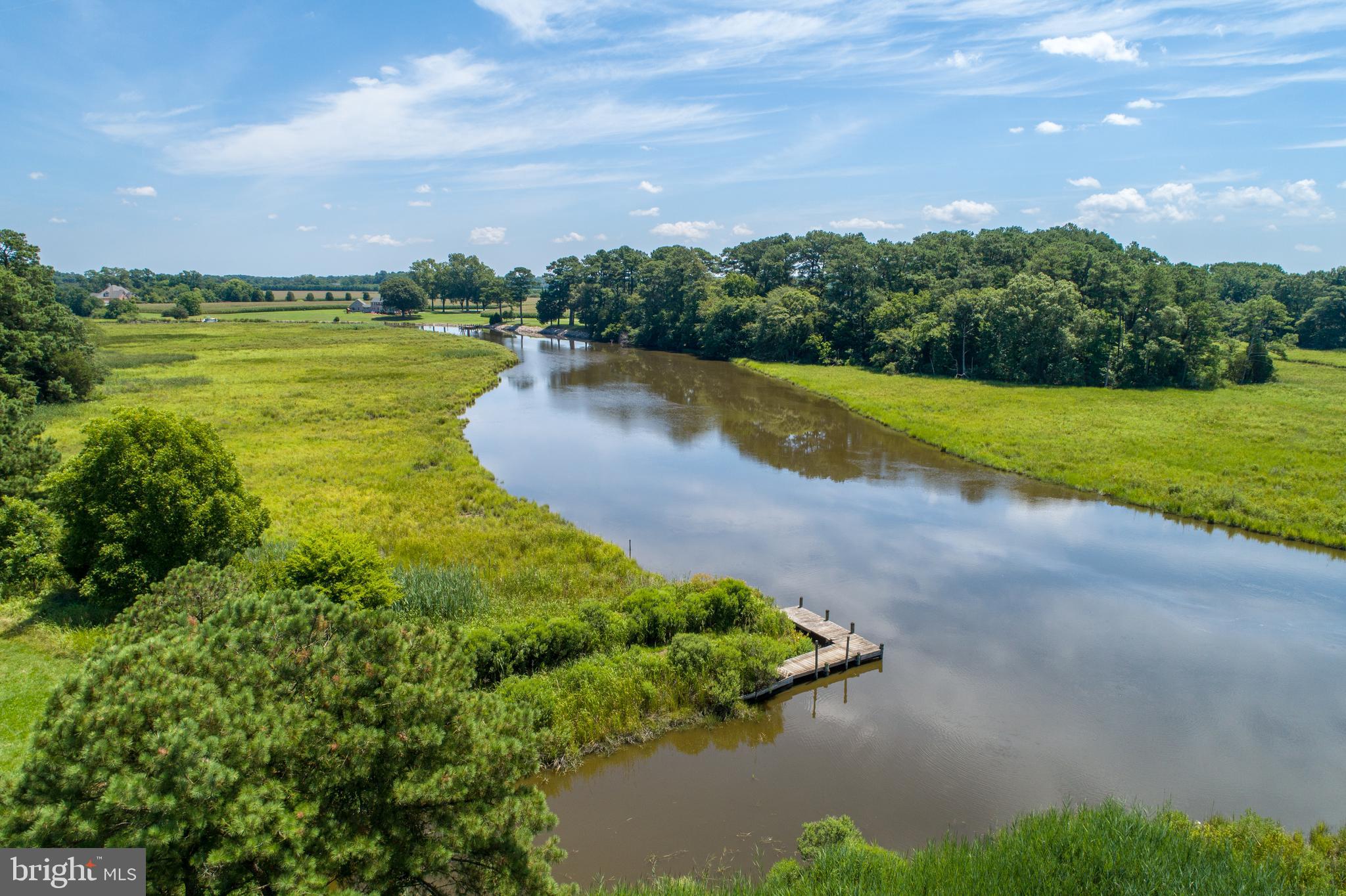 10826 Brownstone Road Princess Anne, MD 21853 - Photo 3 of 68 a view of a lake with a garden