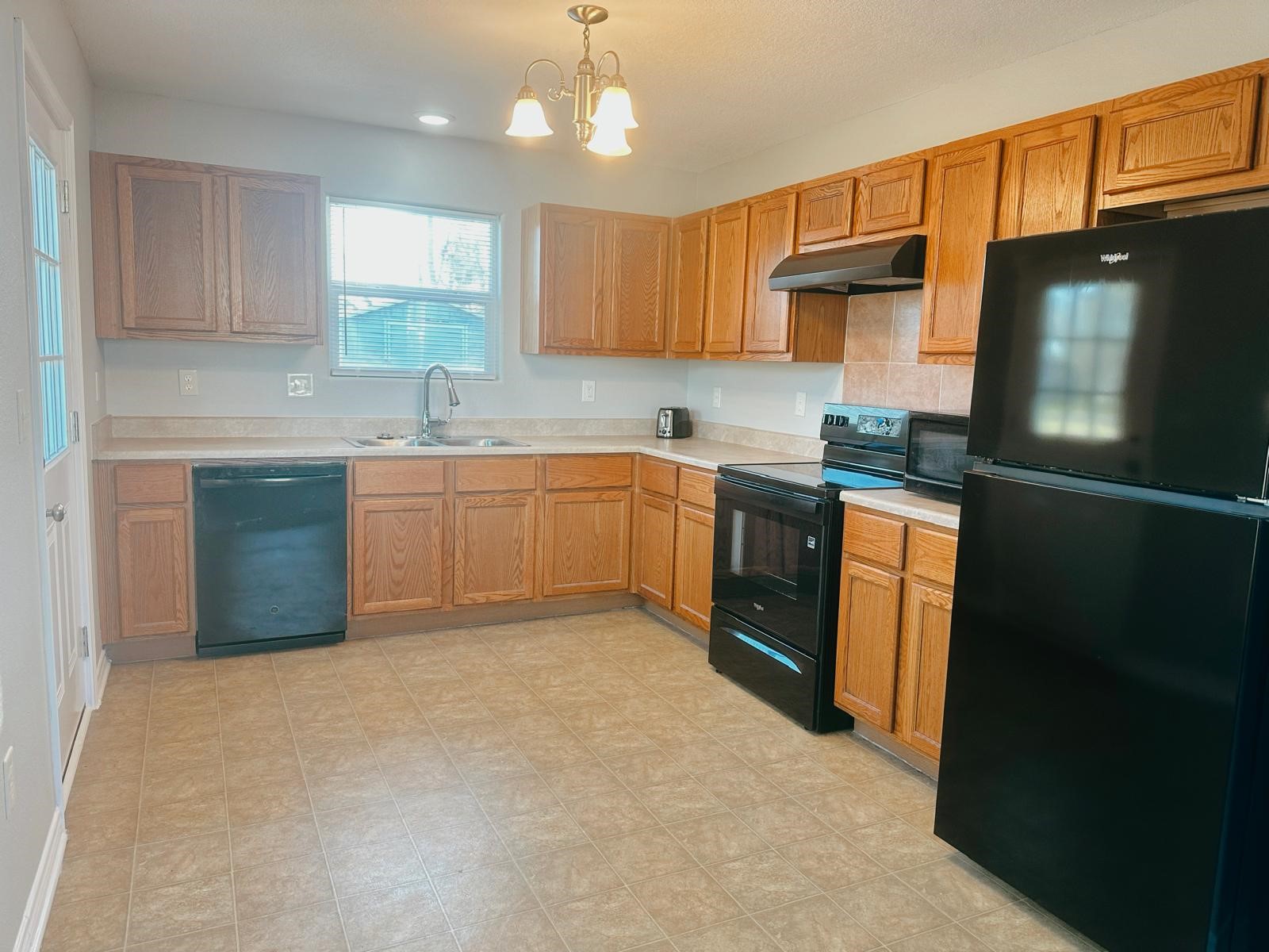 4480 Detroit Street Beaumont, TX 77703 - Photo 8 of 24 a kitchen with stainless steel appliances granite countertop a sink stove and refrigerator