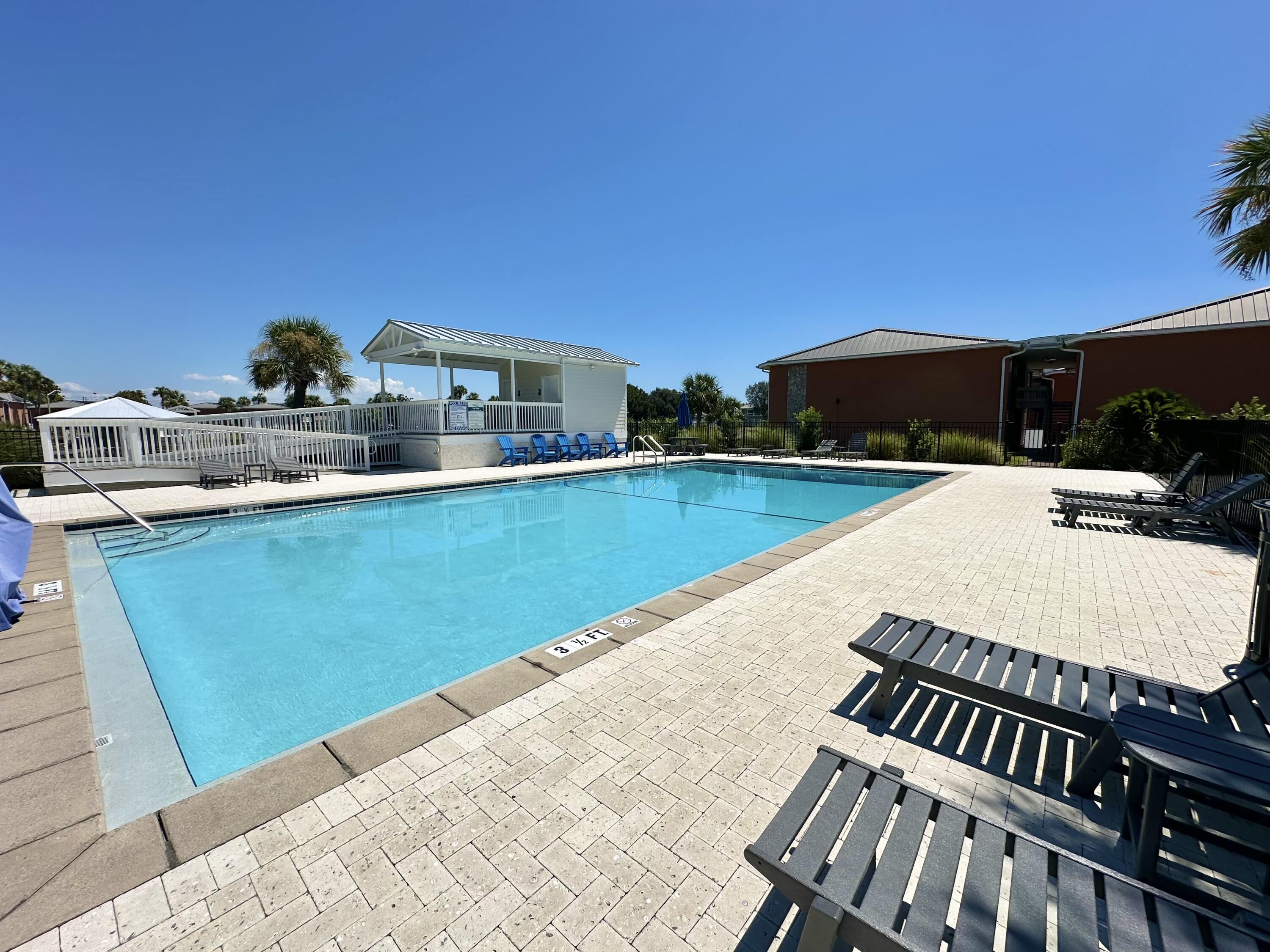 4000 Gulf Terrace Drive, Unit 2008 Destin, FL 32541 - Photo 20 of 35 a view of a swimming pool with a patio and a yard