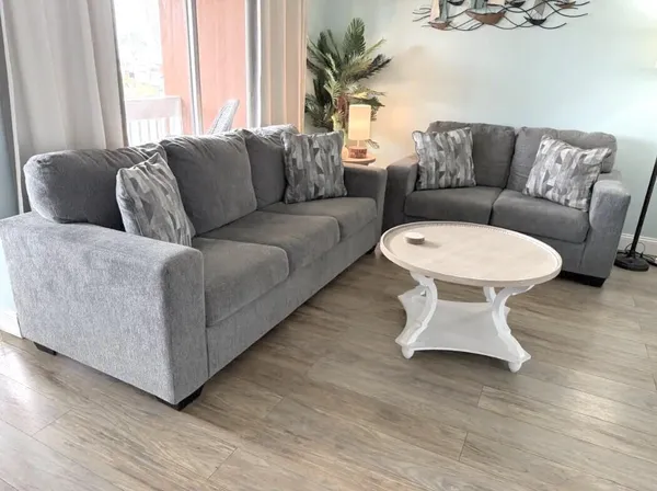 a living room with furniture and a large window