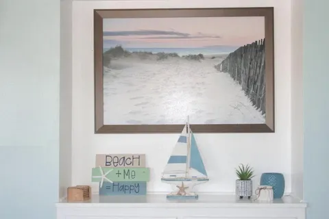 a bedroom with a bed and a potted plant