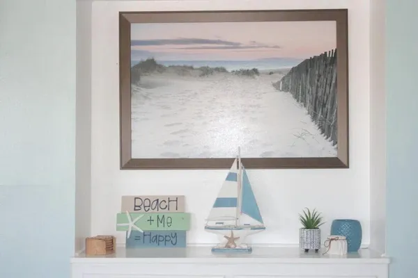 a bedroom with a bed and a potted plant