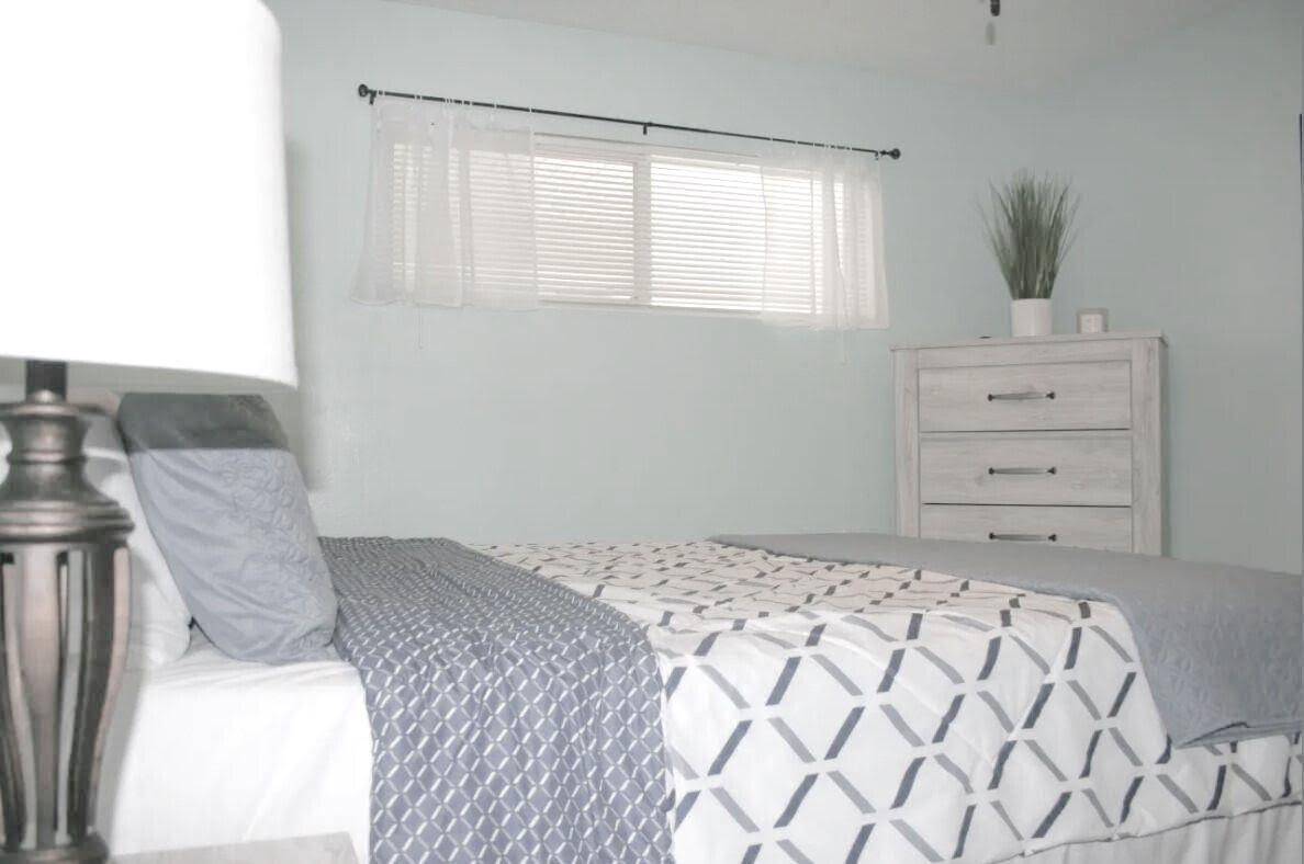 4000 Gulf Terrace Drive, Unit 2008 Destin, FL 32541 - Photo 10 of 35 a bedroom with a bed and a potted plant