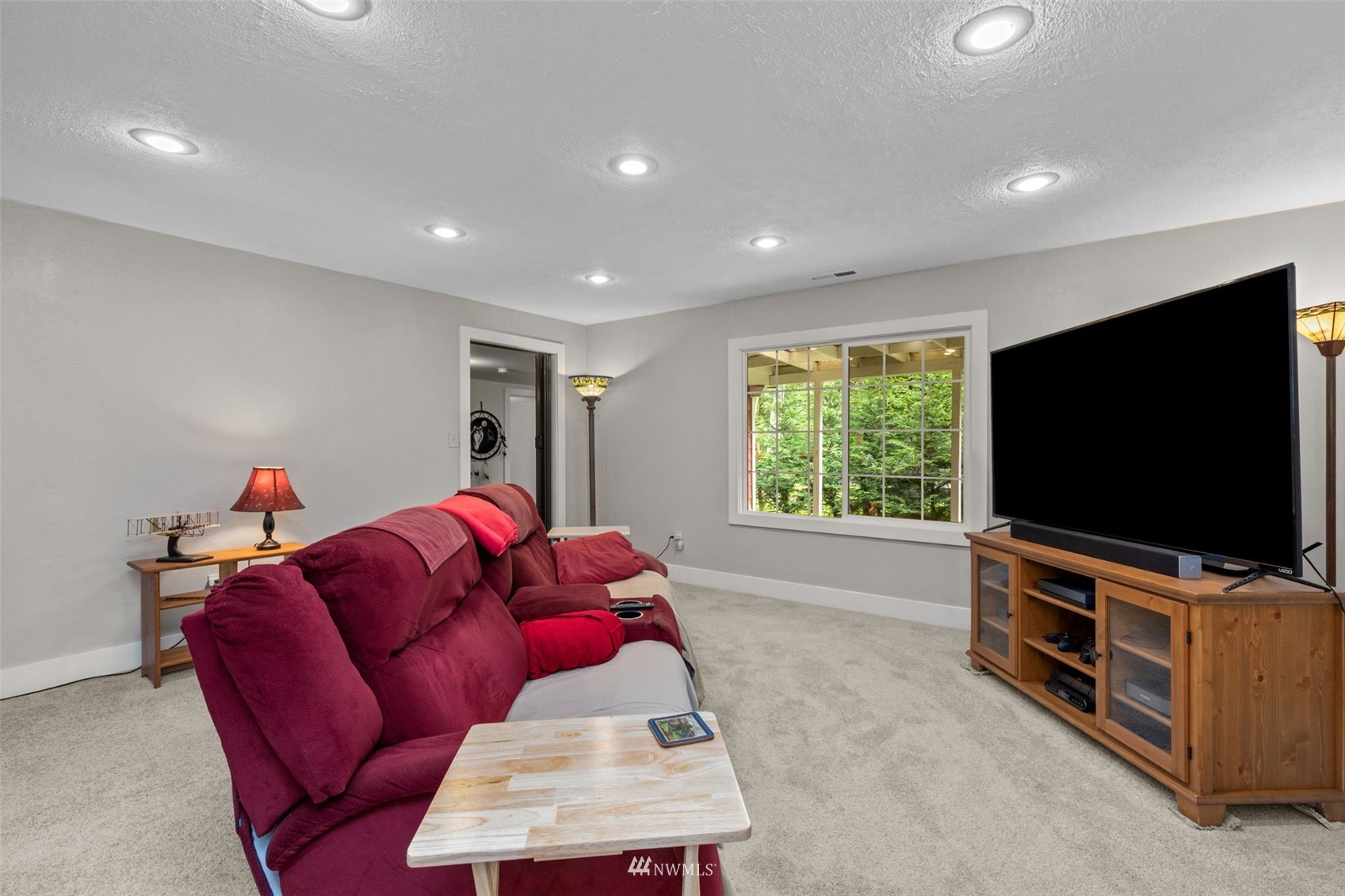16231 Roosevelt Road Snohomish, WA 98290 - Photo 14 of 36 a living room with furniture and a flat screen tv