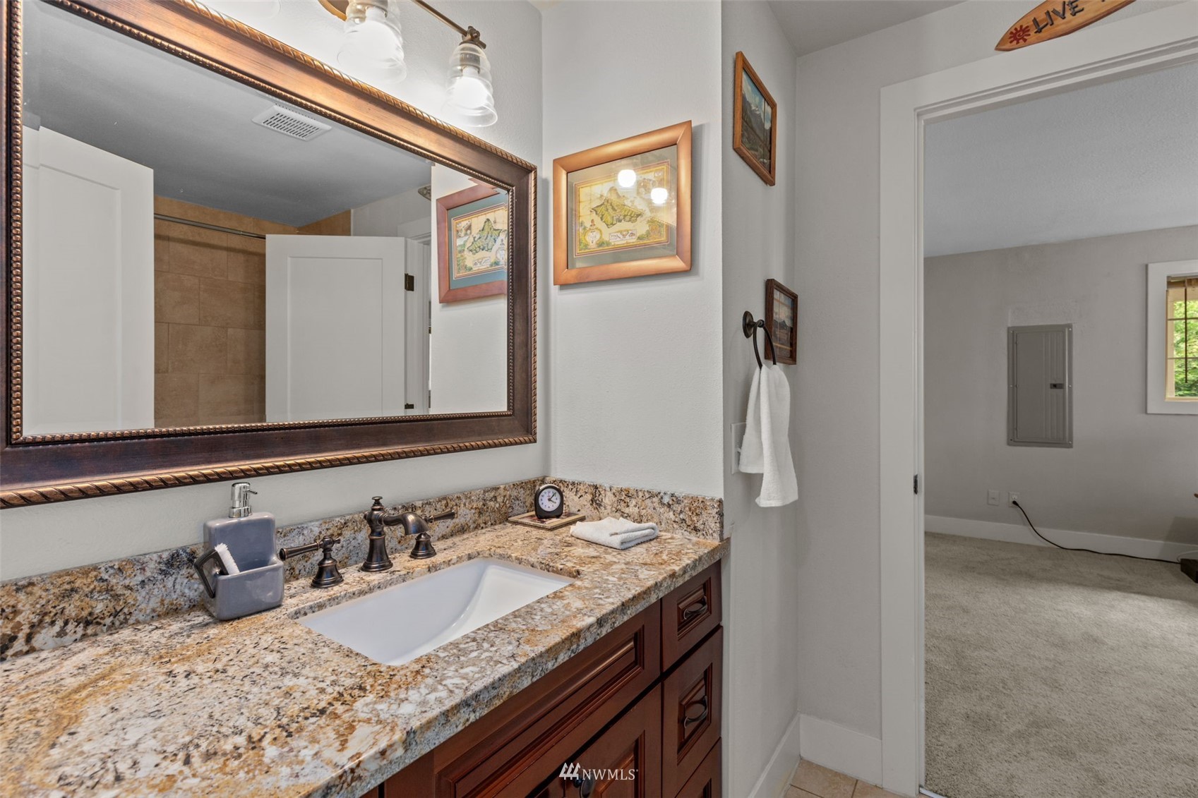 16231 Roosevelt Road Snohomish, WA 98290 - Photo 21 of 36 a bathroom with a granite countertop sink and a mirror