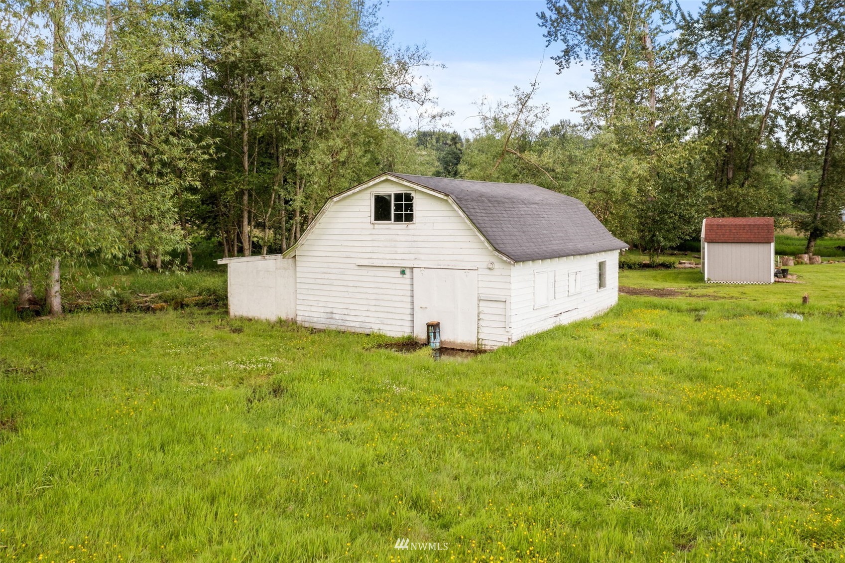 16231 Roosevelt Road Snohomish, WA 98290 - Photo 33 of 36 a white house that has a tree in the background