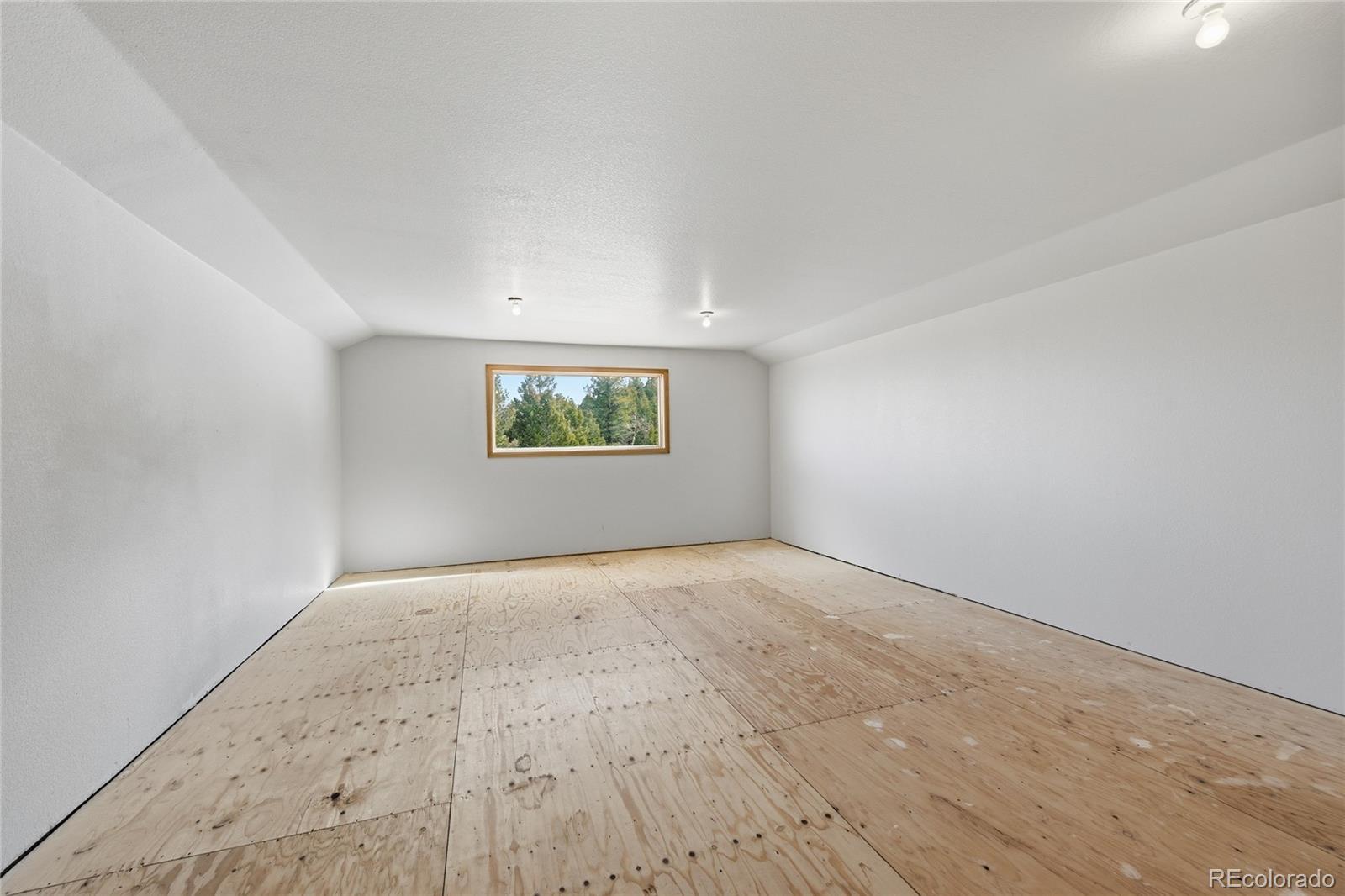 31842 Steven Way Conifer, CO 80433 - Photo 13 of 19 an empty room with a empty space and window