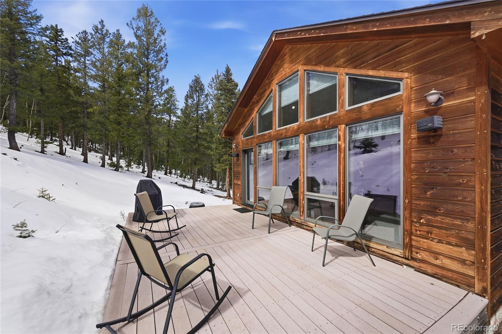 31842 Steven Way Conifer, CO 80433 - Photo 17 of 19 a view of a roof deck with chair and tables