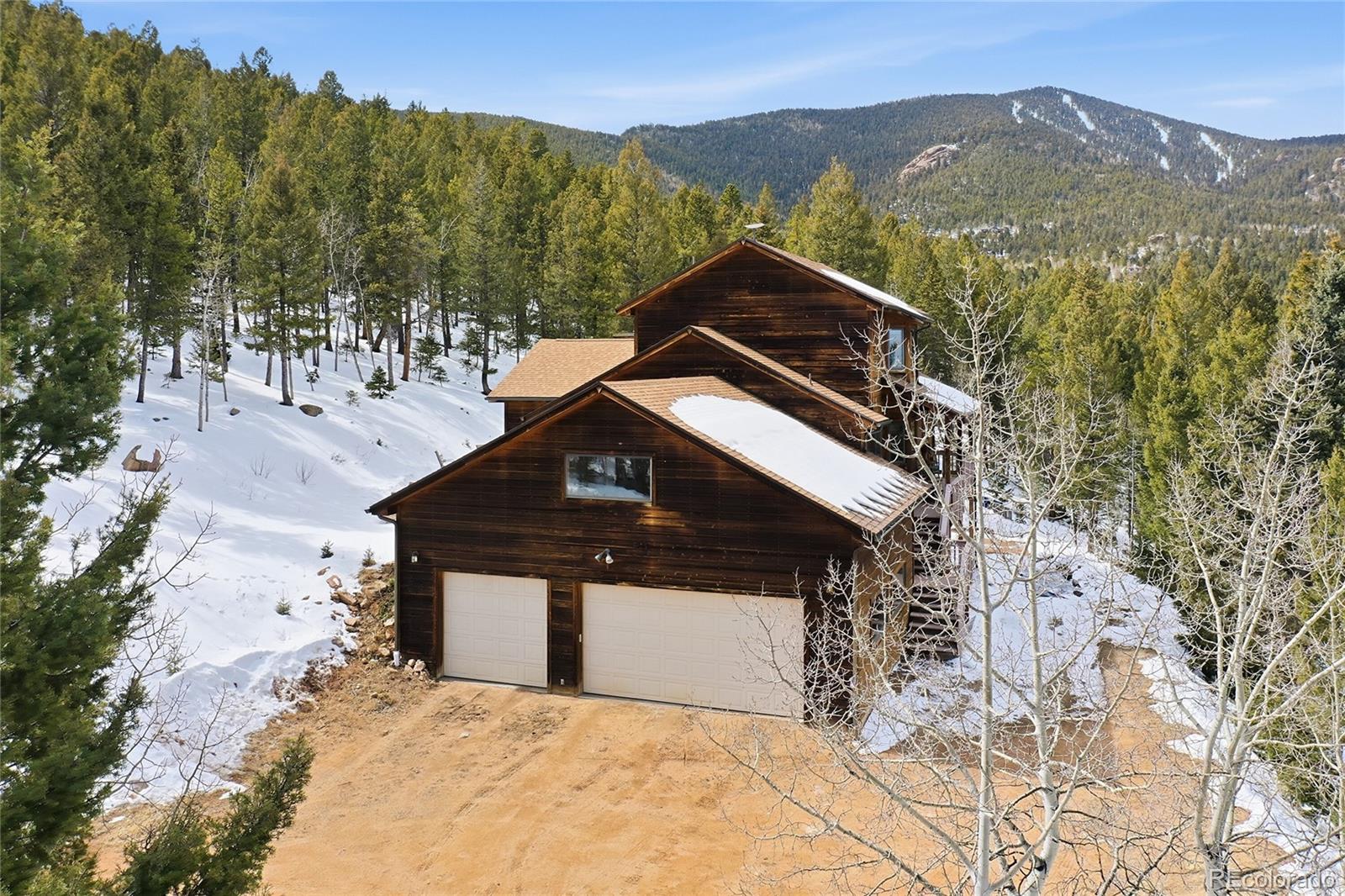 31842 Steven Way Conifer, CO 80433 - Photo 18 of 19 a view of a house with a mountain