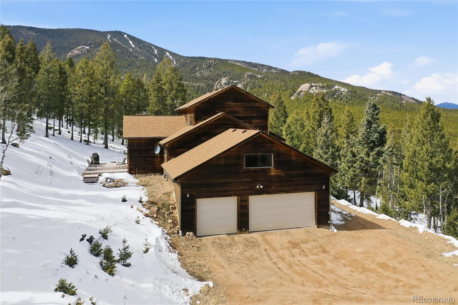 31842 Steven Way Conifer, CO 80433 - Photo 3 of 19 a front view of a house with a yard