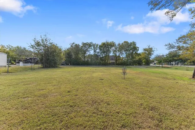a view of a swimming pool and an outdoor seating