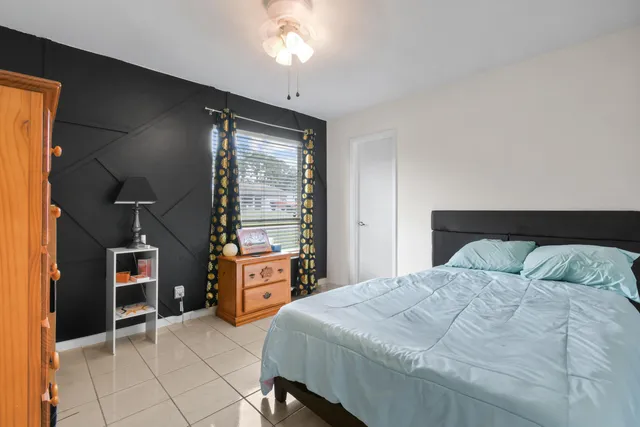 a bedroom with a bed and a cabinets