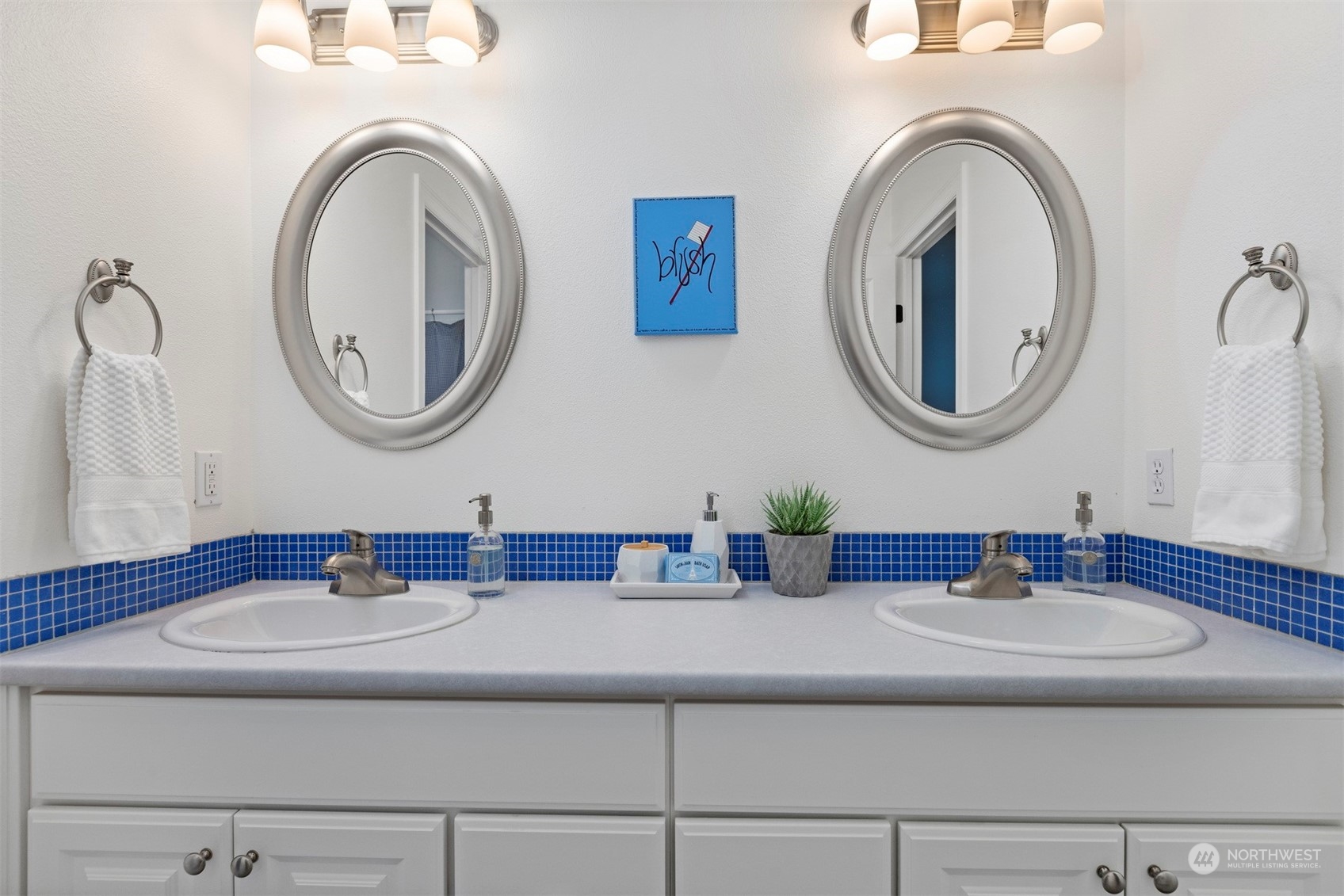 715 Linden Road Bellingham, WA 98229 - Photo 19 of 40 a bathroom with a sink and a mirror
