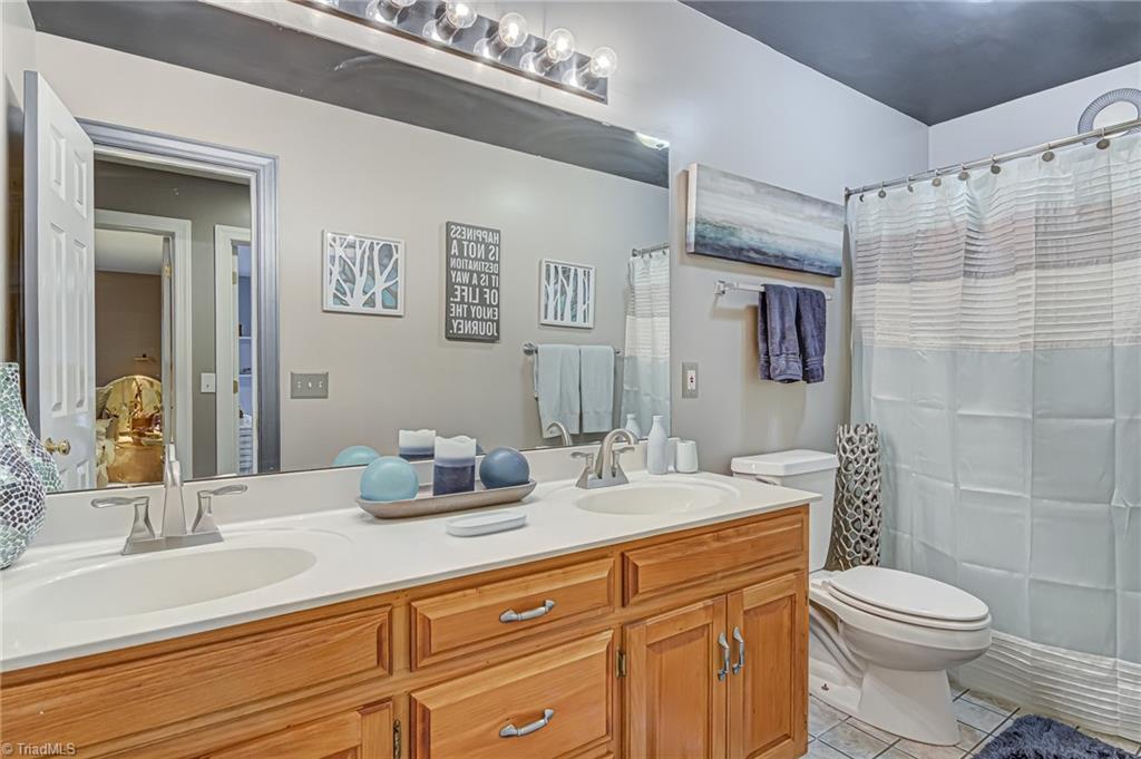 4472 Kendale Road High Point, NC 27265 - Photo 24 of 36 Full bathroom with double sink vanity located on second floor.