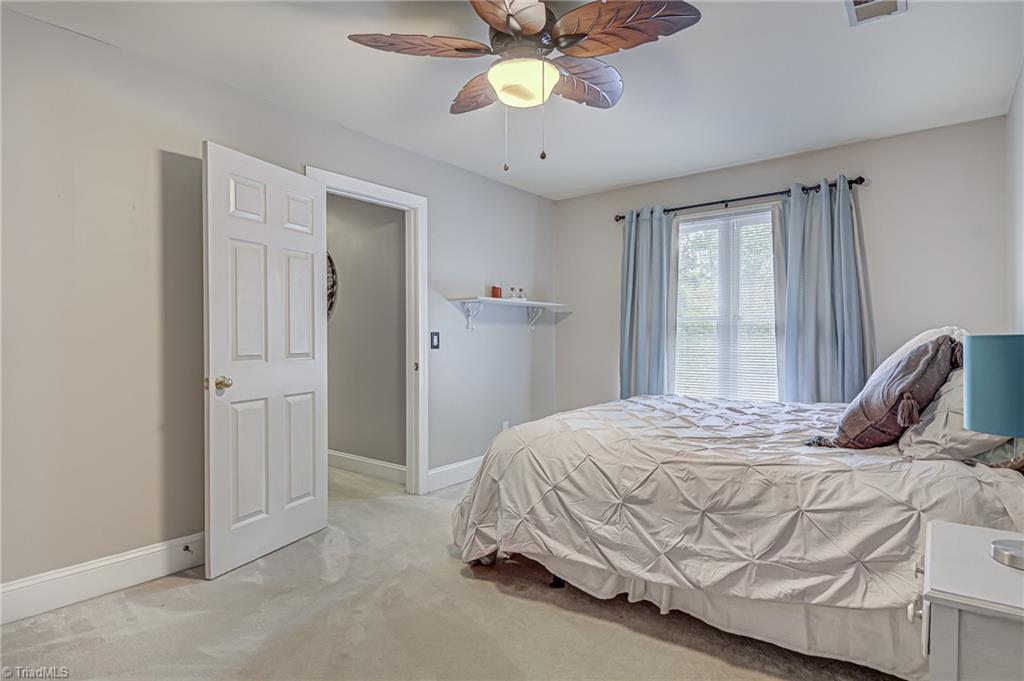4472 Kendale Road High Point, NC 27265 - Photo 27 of 36 Bonus room features large window, ceiling fan, and walk-in closet! Easily used as a 4th bedroom