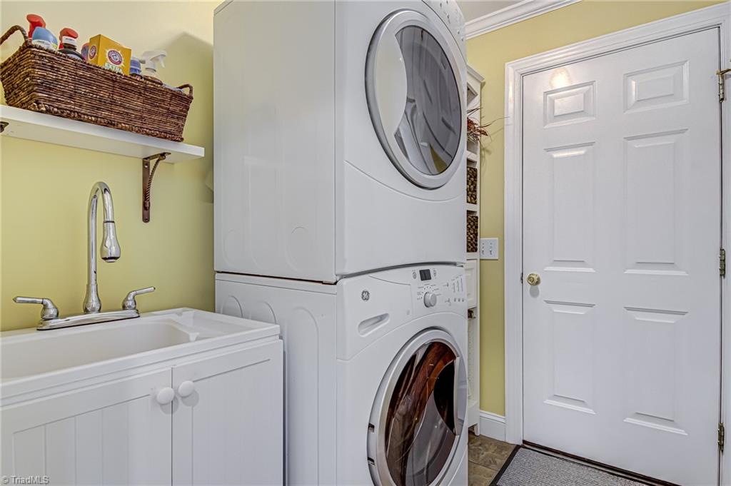 4472 Kendale Road High Point, NC 27265 - Photo 29 of 36 Laundry room located in main. Also functions as a "mud room". Door in photo is from the garage.