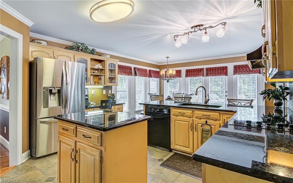 4472 Kendale Road High Point, NC 27265 - Photo 6 of 36 This wonderful kitchen boasts granite countertops, lots of cabinetry and natural light.