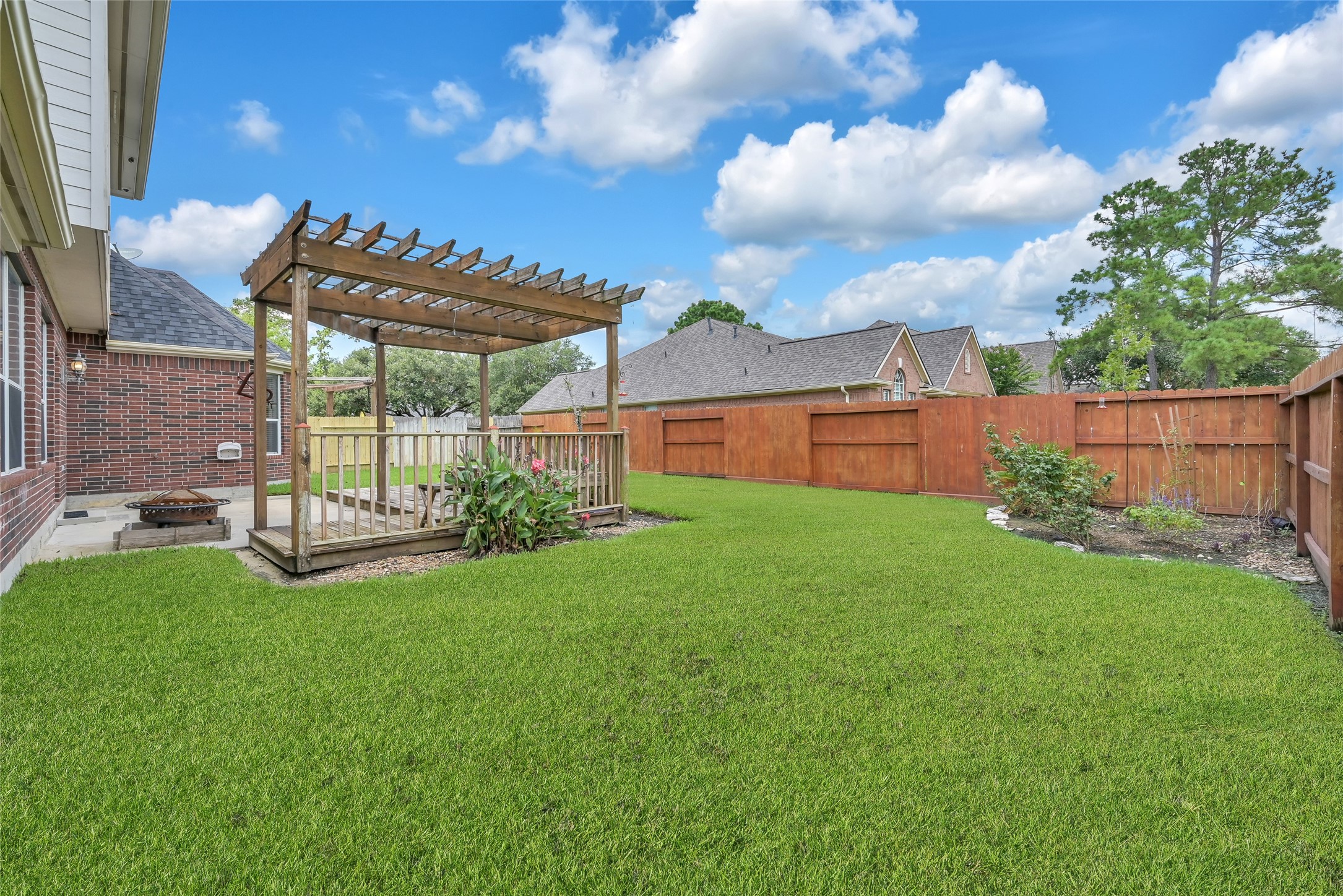 23202 Drywood Crossing Court Spring, TX 77373 - Photo 30 of 31 Fully Fenced Backyard with Pergola