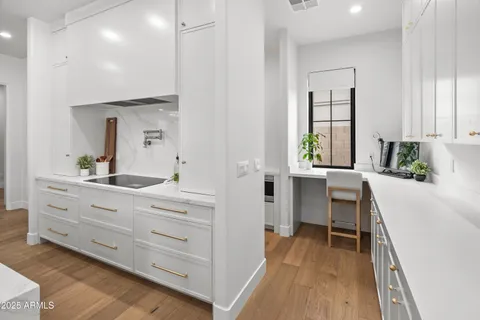 a kitchen with a stove and a microwave