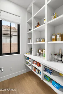 a room with lots of furniture and windows