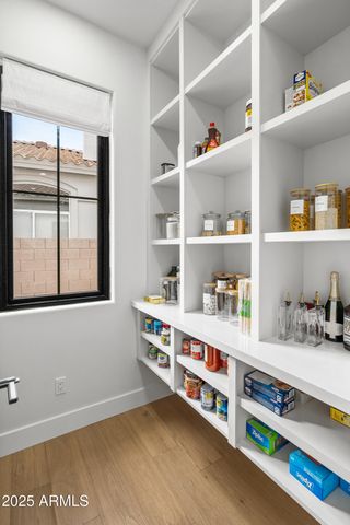 a room with lots of furniture and windows