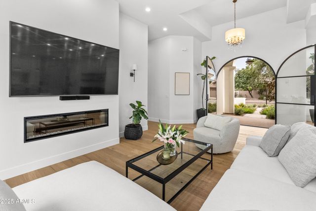 a bathroom with a sink a mirror and vanity