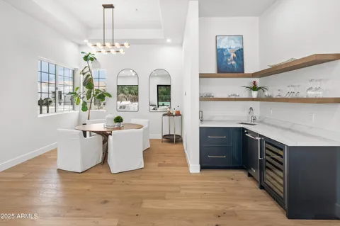 a spacious bedroom with a bed a window and a flat screen tv