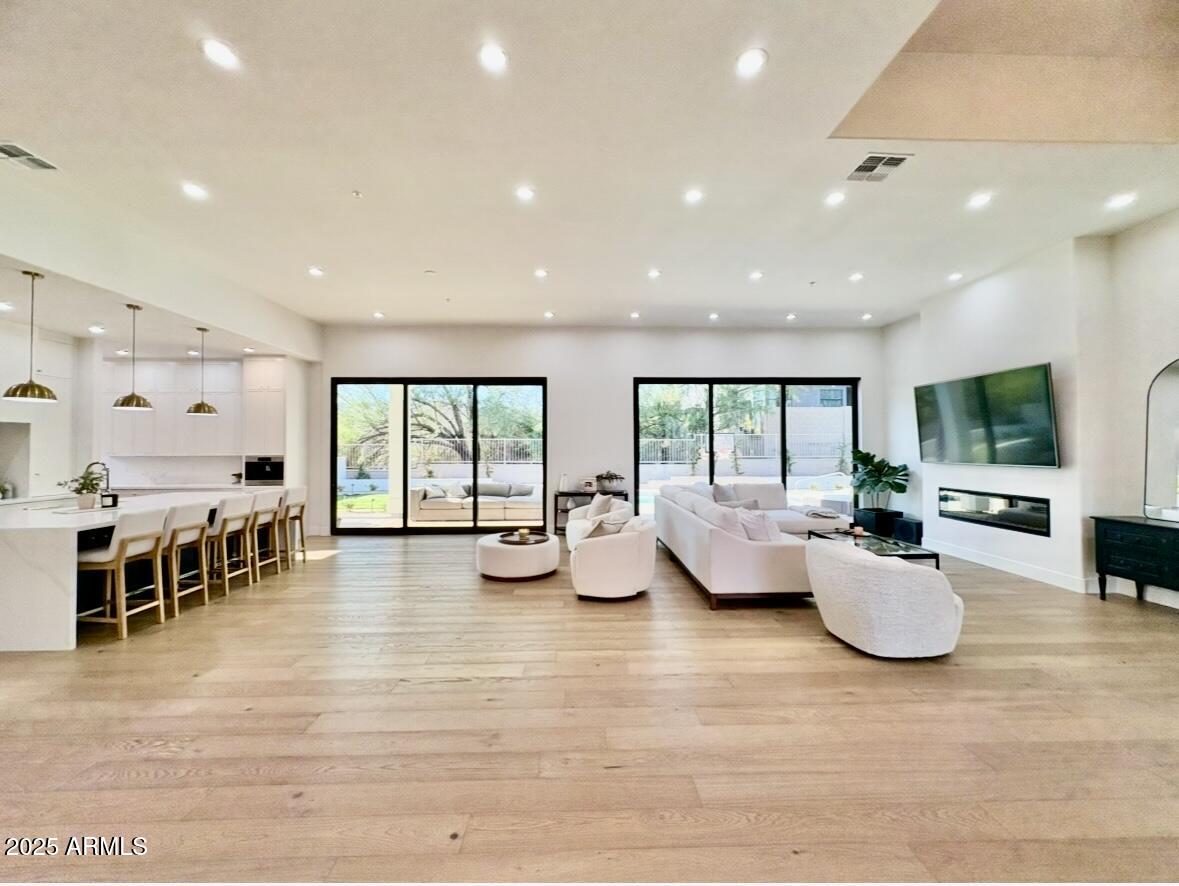 12134 East Mercer Lane Scottsdale, AZ 85259 - Photo 20 of 35 a room with lots of furniture and windows