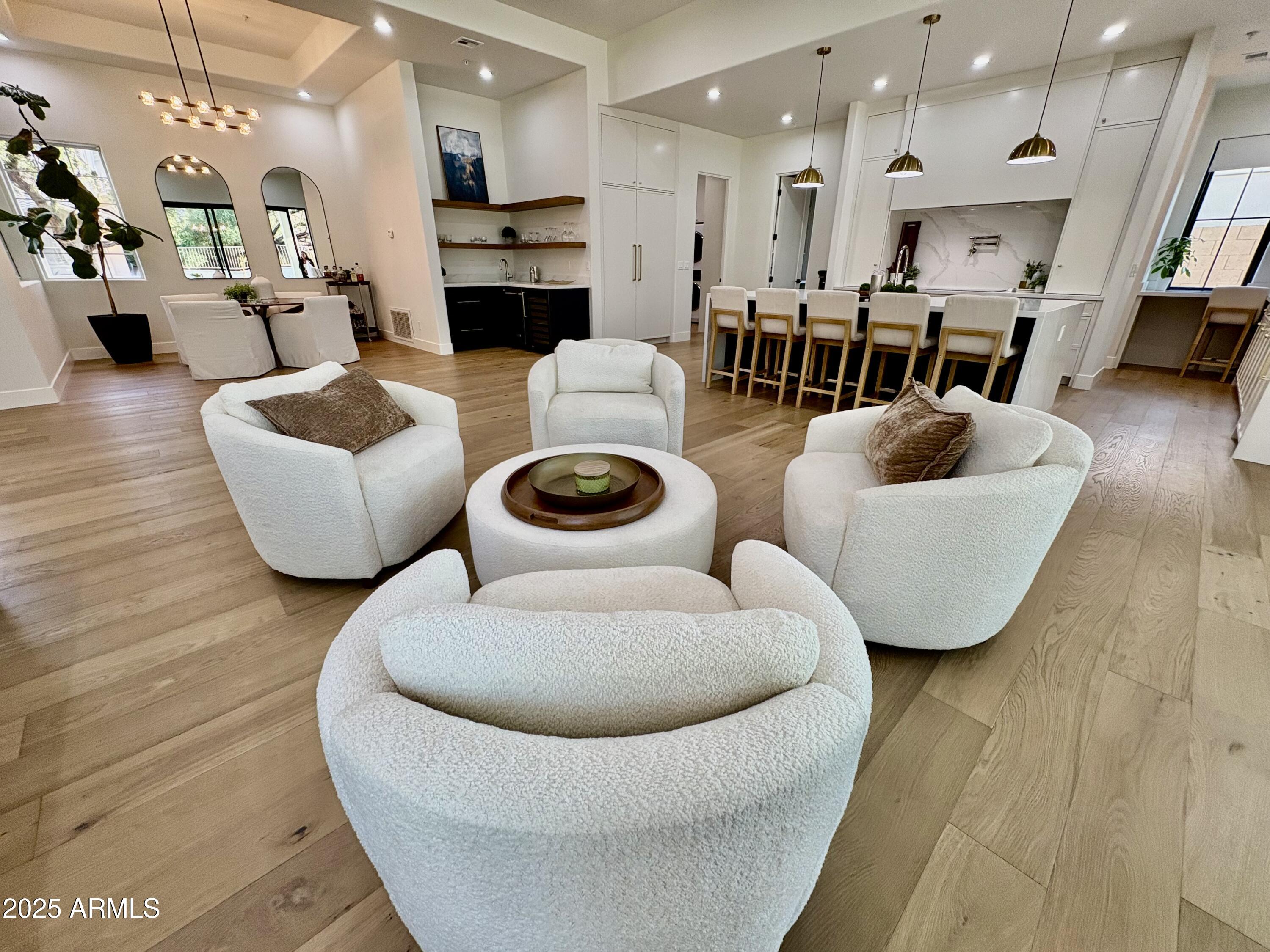 12134 East Mercer Lane Scottsdale, AZ 85259 - Photo 21 of 35 a living room with furniture and a wooden floor