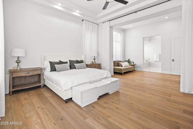 a work room with furniture and a wooden floor