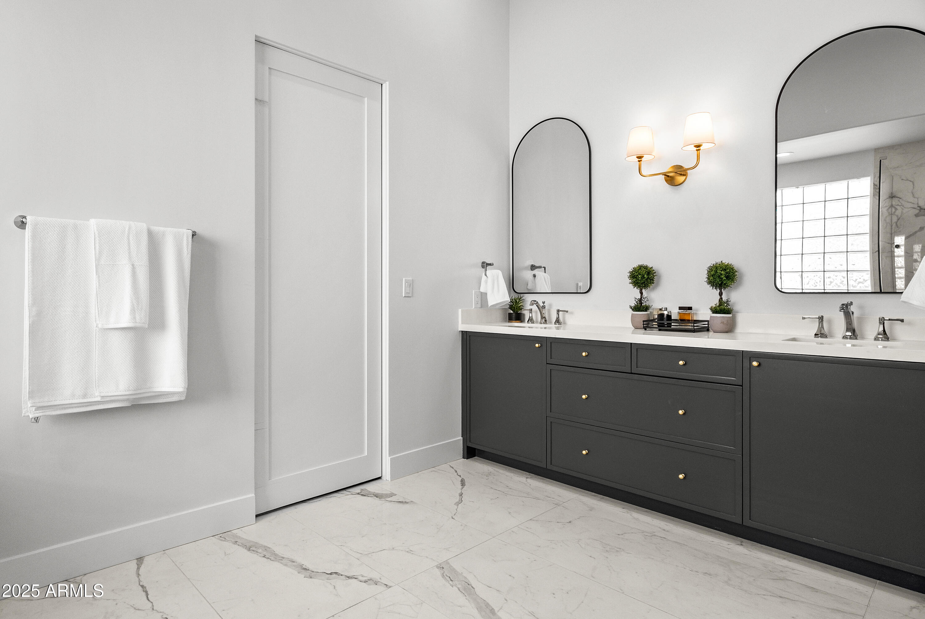 12134 East Mercer Lane Scottsdale, AZ 85259 - Photo 26 of 35 a bathroom with a double vanity sink and mirror