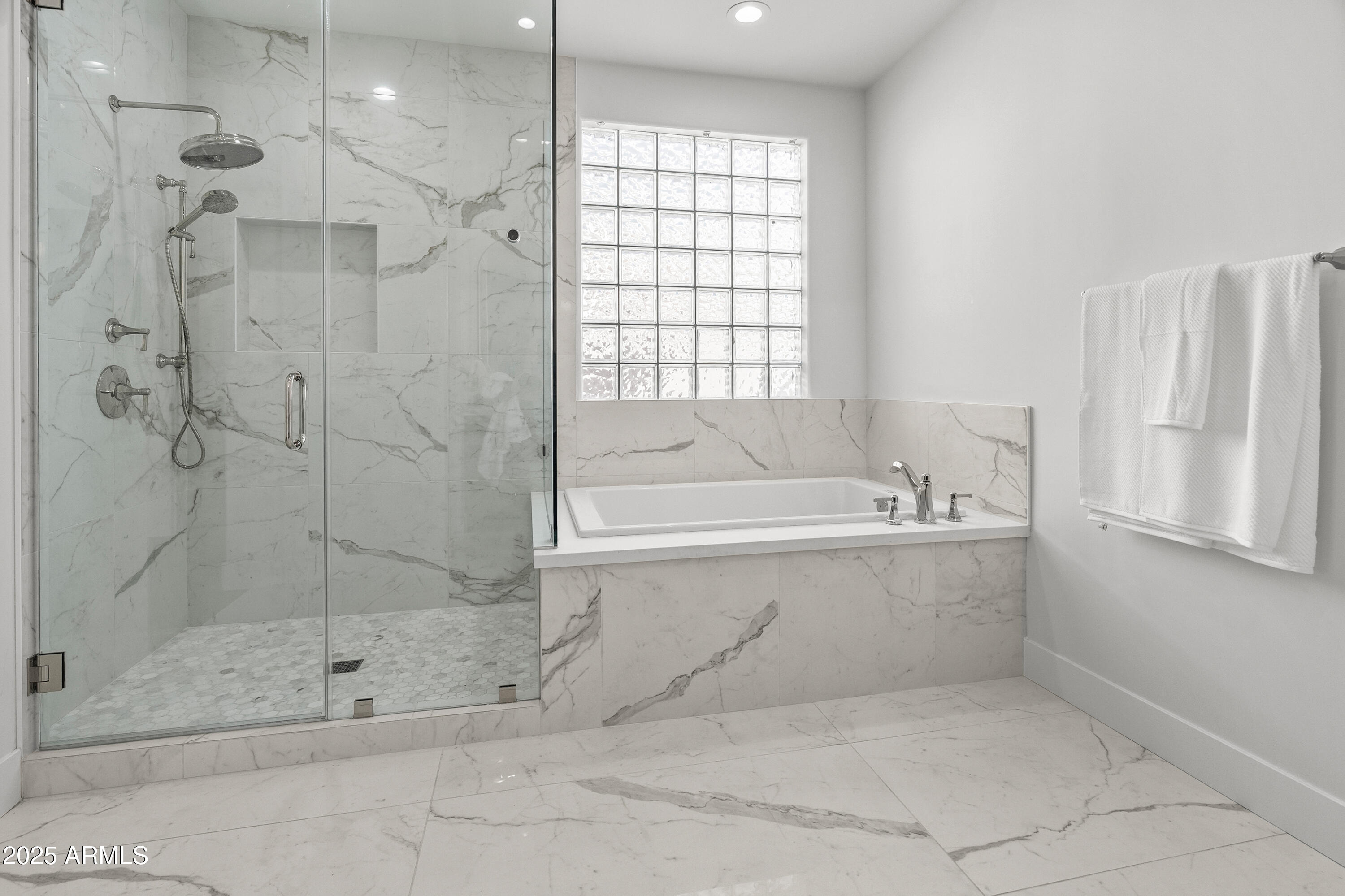 12134 East Mercer Lane Scottsdale, AZ 85259 - Photo 27 of 35 a bathroom with a bathtub and shower
