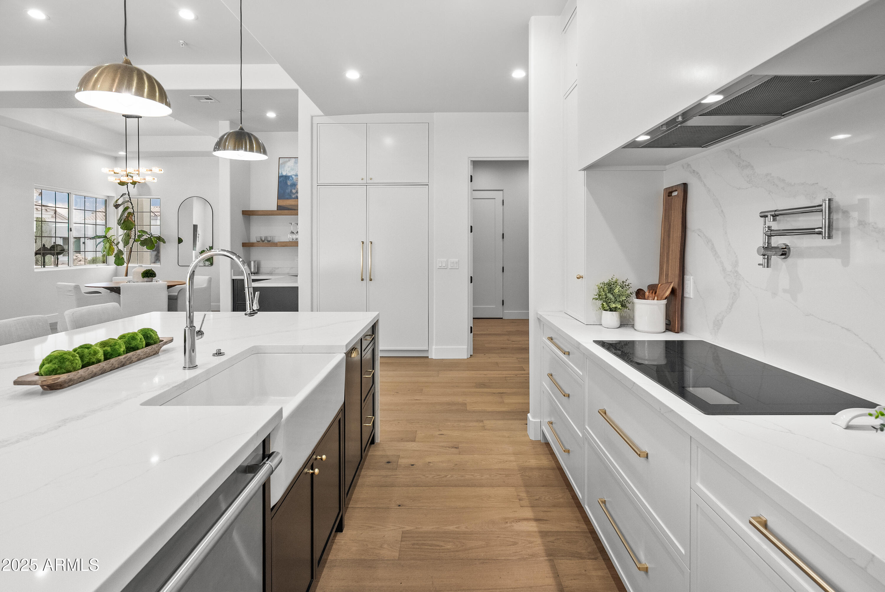 12134 East Mercer Lane Scottsdale, AZ 85259 - Photo 9 of 35 a large kitchen with granite countertop a sink and a refrigerator