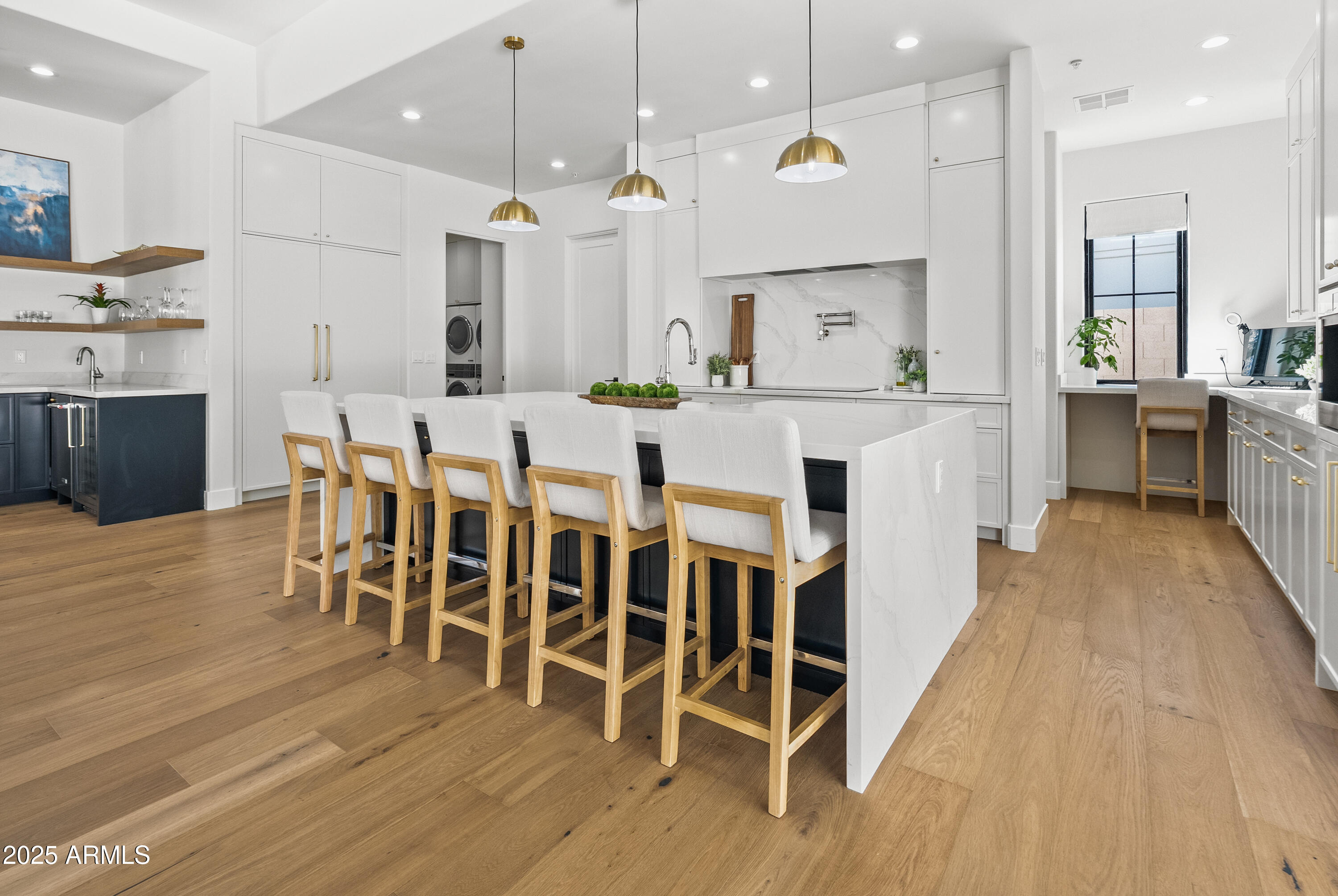12134 East Mercer Lane Scottsdale, AZ 85259 - Photo 10 of 35 a large kitchen with a table and chairs