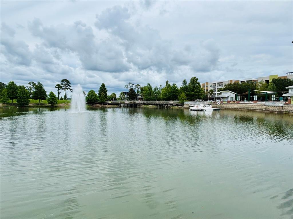 1045 Shaffer Trail Oviedo, FL 32765 - Photo 26 of 30 a view of a lake with houses in the back