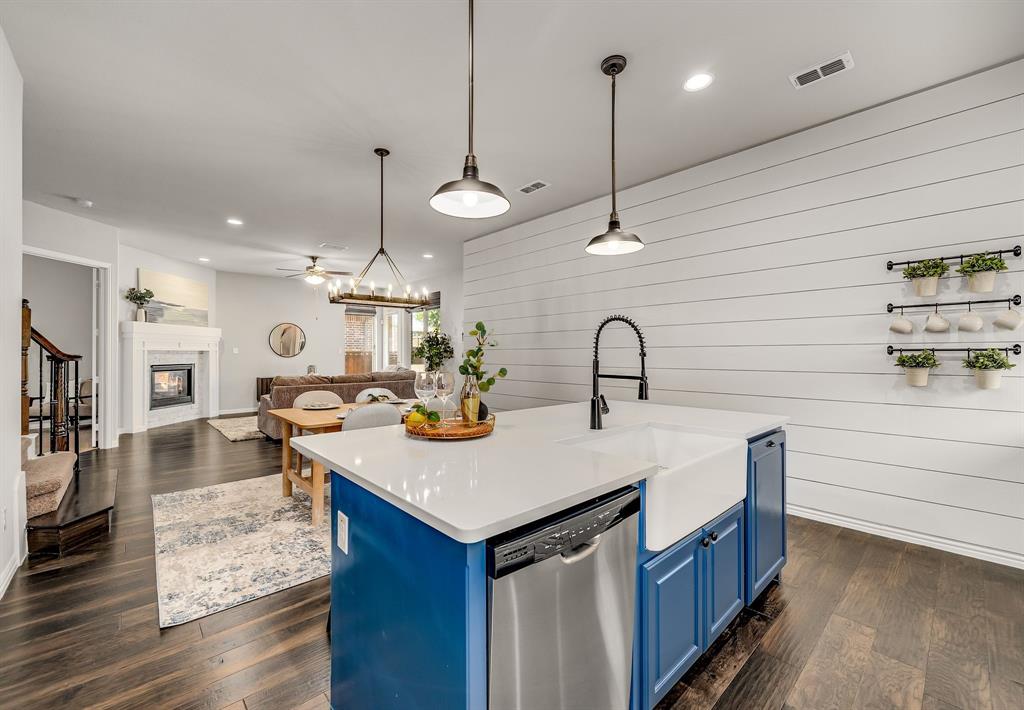 3341 Man O War Road Celina, TX 75009 - Photo 11 of 40 a kitchen with sink and living room view
