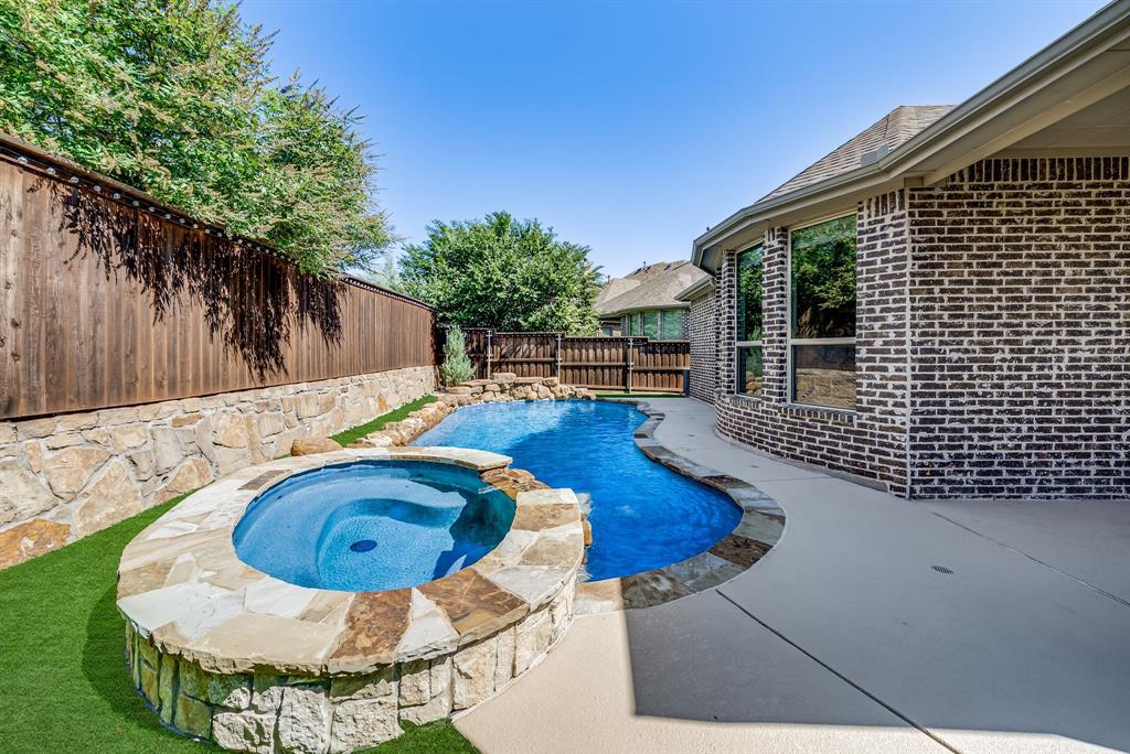 3341 Man O War Road Celina, TX 75009 - Photo 30 of 40 a swimming pool with barbeque oven in front of it