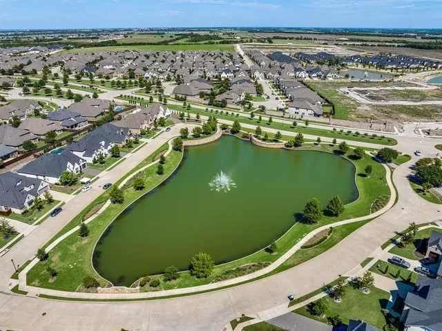 an aerial view of a residential building with outdoor space